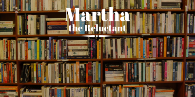 Fully stacked bookcase. Text says Martha the Reluctant.